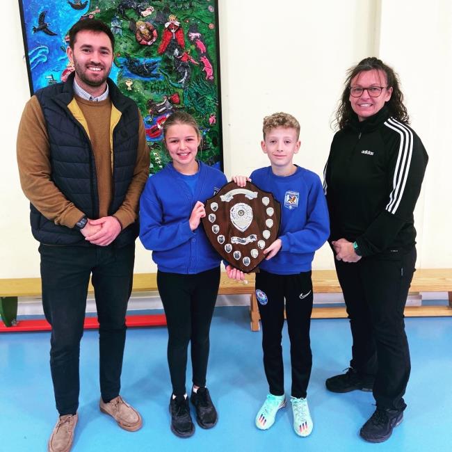 Mr Ricky Pearson and Theresa Canton with the school cross country captains